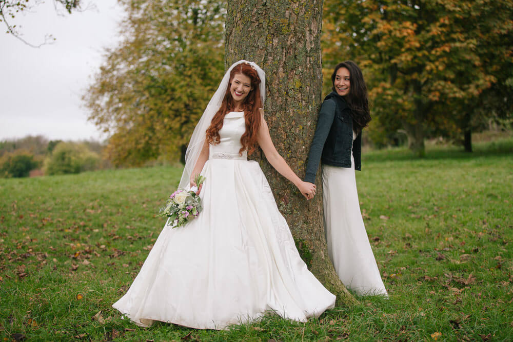 Jessie and Claudia by a tree for their Lesbian Wedding Shoot image copyright Rachel Movitz Weddings via the Gay Wedding Guide 1 5