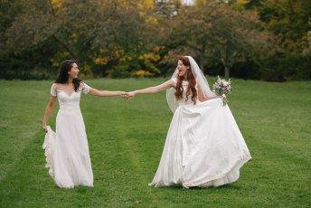 Jessie And Claudia Hand In Hand In Field On Their Lesbian Wedding Shoot Image Copyright Rachel Movitz Weddings Via The Gay Wedding Guide 1 5 344X230