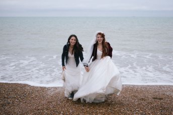 Jessie And Claudias Run Out Of The Sea At Brighton Beach Lesbian Wedding Shoot Image Copyright Rachel Movitz Weddings Via The Gay Wedding Guide 1 5 344X230