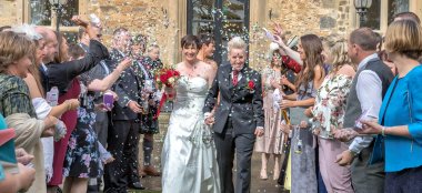 Kat And Ali Under Confetti Shower At Their Lesbian Wedding Photographer This World Wedding Photography Via Gay Wedding Guide 6 380X174
