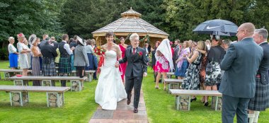 Kat And Ali Walk Down Aisle At Their Lesbian Wedding Photographer This World Wedding Photography Via Gay Wedding Guide 6 380X174