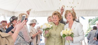 Lesbian Couple Under Confetti At Beach Weddings Bournemouth Gay Wedding Guide Image Copyright Anna Morgan Photography 9 380X174