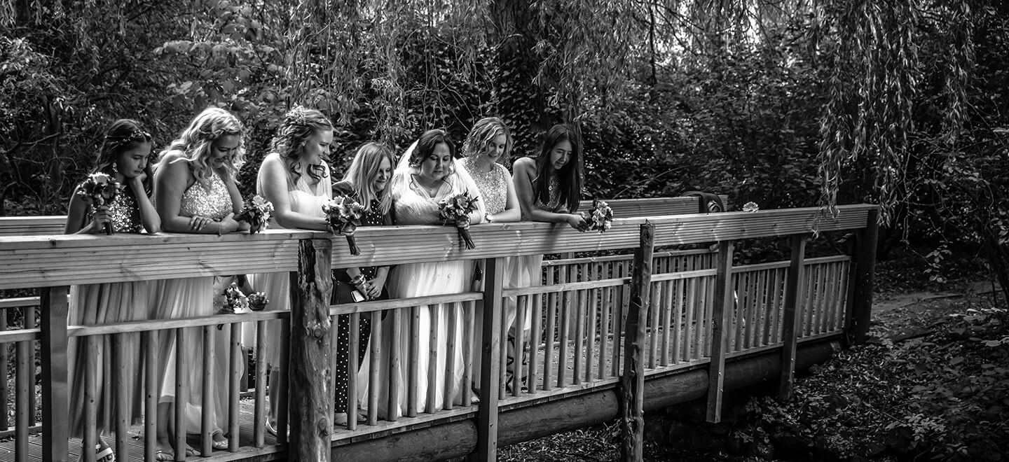 Lesbian bridal party on bridge photograph by Paul Walker Photographer Gay Wedding Guide 6