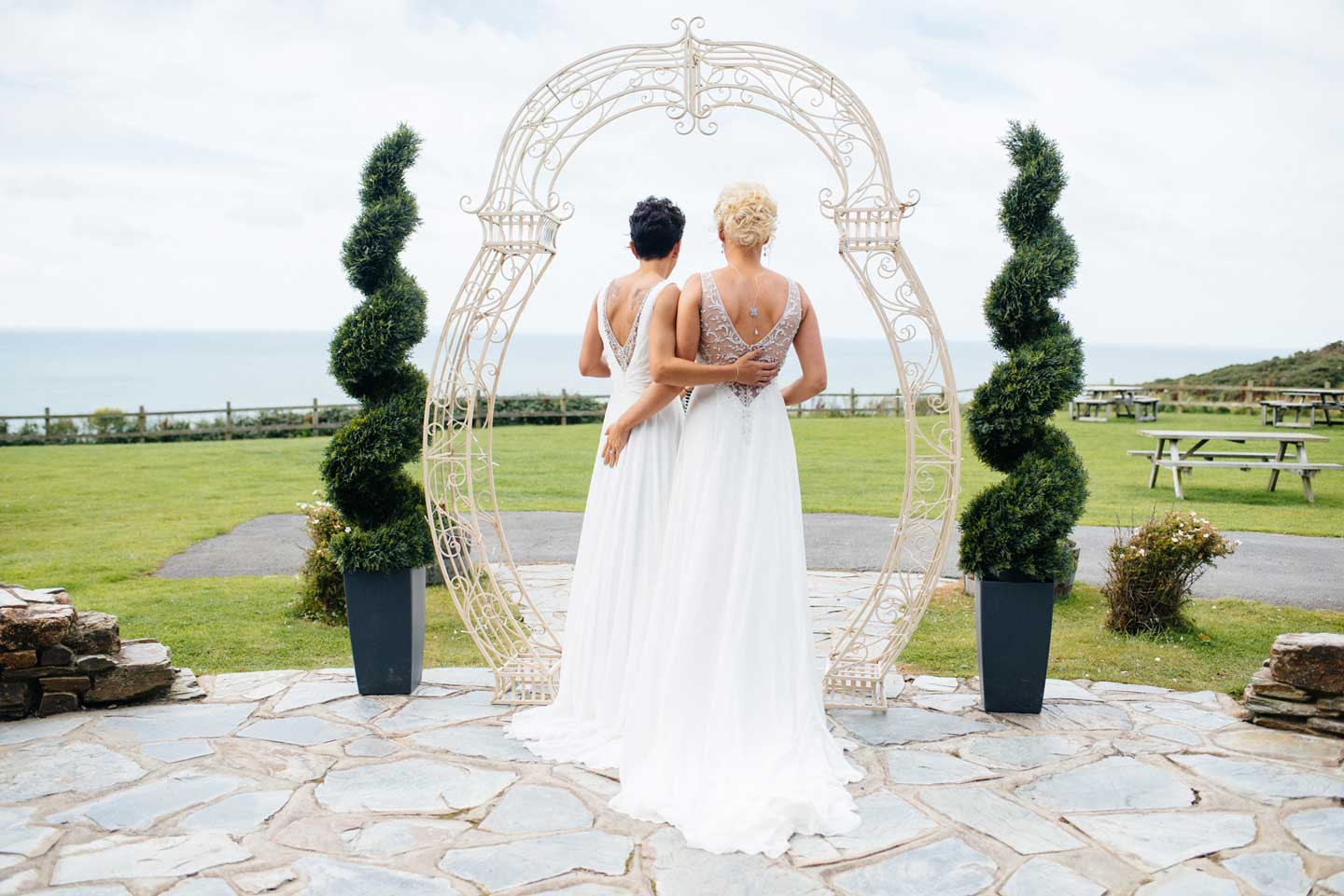 Lesbian brides overlooking the sea at emma and amy lesbian wedding at ocean kave image by MrsJutsonPhotography 1 5