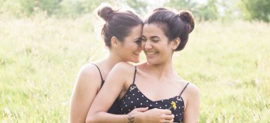 Lesbian Engagement Shoot Giggling In Field Photo Copyright Michael Love Lesbian Wedding Photographer Ireland 6 380X174