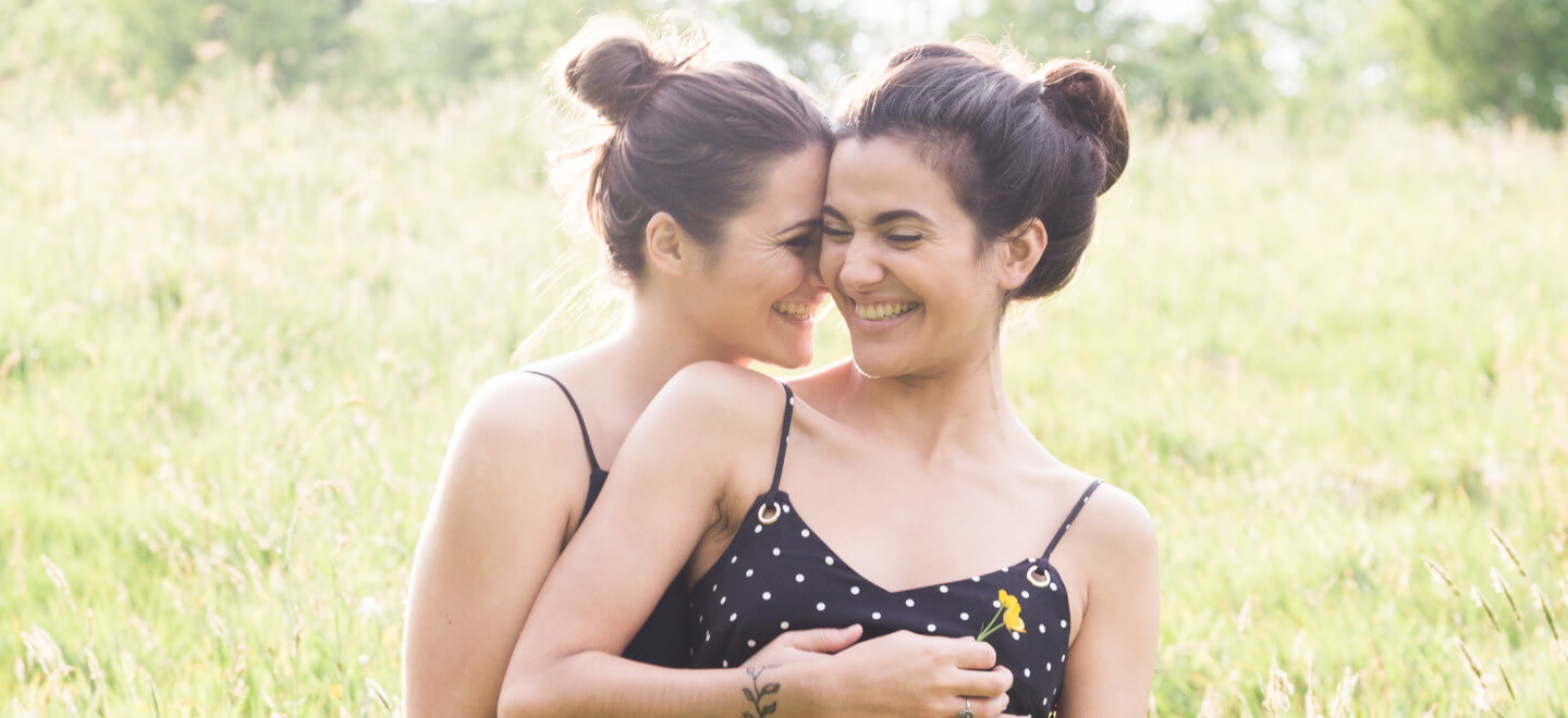 Lesbian Engagement Shoot Giggling In Field Photo Copyright Michael Love Lesbian Wedding Photographer Ireland 6