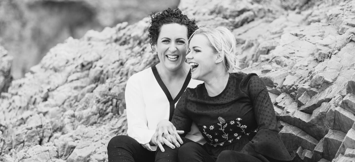 Lesbian engagement shoot on rocks photo copyright Michael Love lesbian wedding photographer Ireland 6