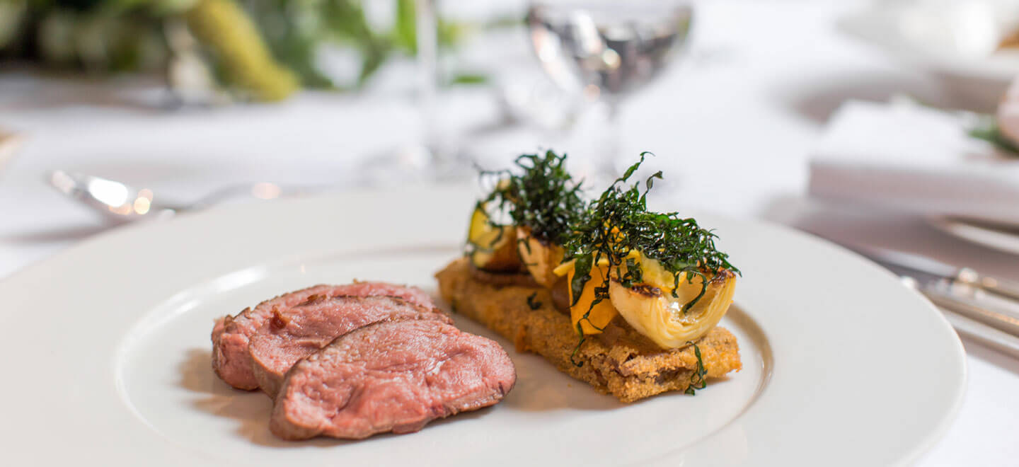 Meat on dinner plate at The London EDITION hotel soho wedding venue gay wedding guide 9