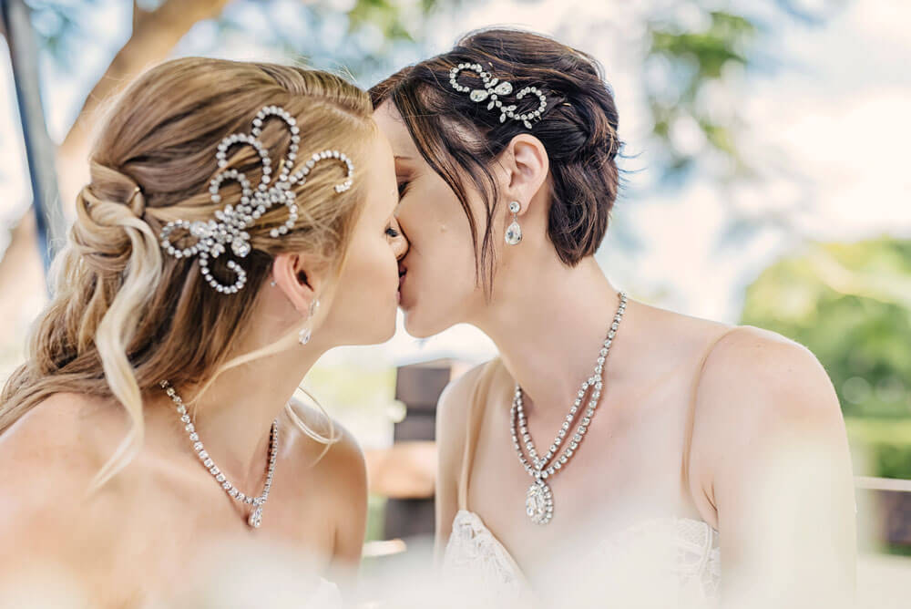 Megan and Fiona kiss at their lesbian wedding australia shoot via Brisbane City Celebrants Elysia and the gay wedding guide 8