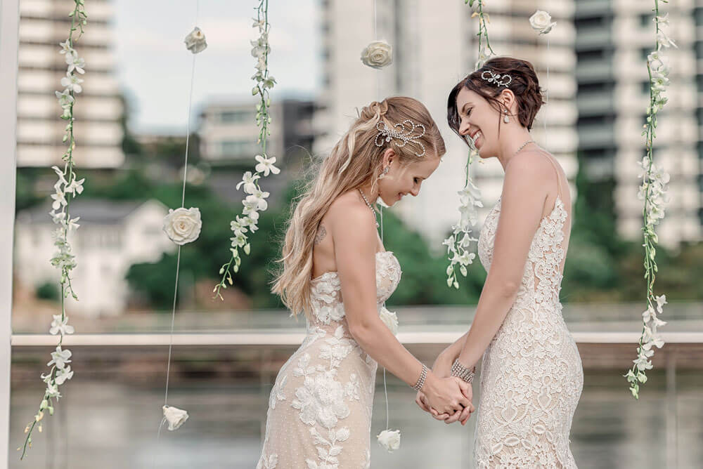 Megan and Fiona suspended flower arch at their lesbian wedding australia shoot via Brisbane City Celebrants Elysia and the gay wedding guide 8