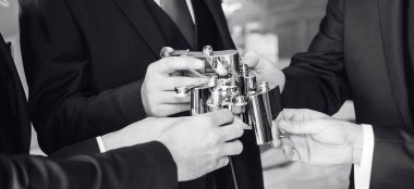 Men Toast With Hipflasks At Richmond Hill Hotel Surrey Wedding Venue Gay Wedding Guide 9 380X174