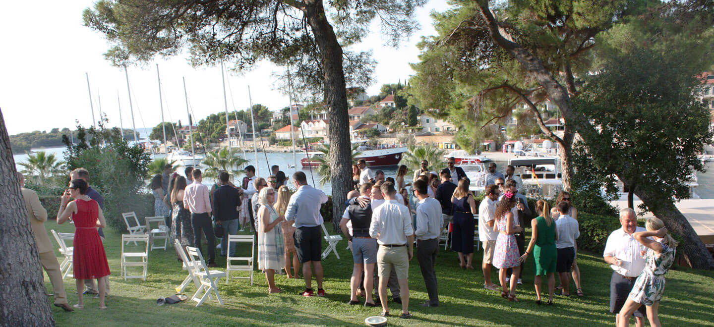 Mingling by the harbour at Nick and Toms real gay wedding croatia via The Gay Wedding Guide 1 5