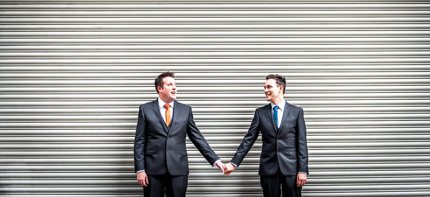 Neil and Ryan by corrugated door by James Tracey gay wedding photography via the gay wedding guide 6