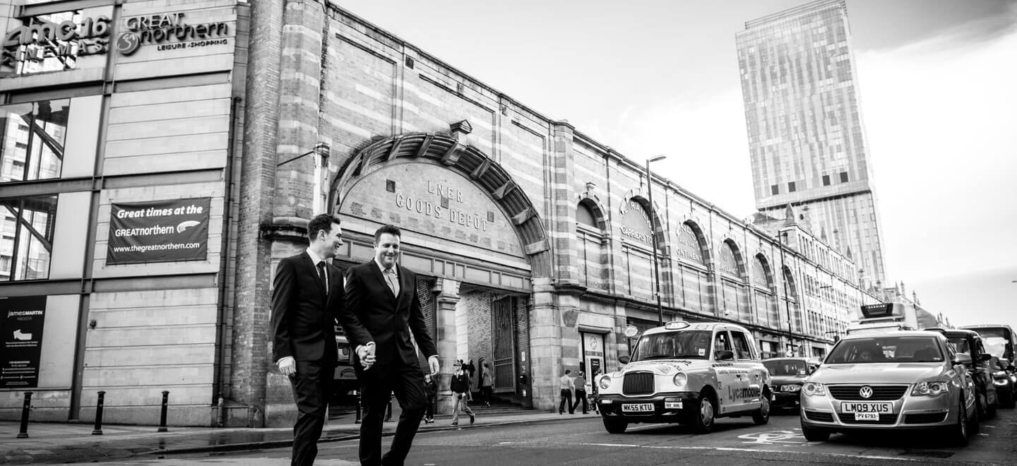 Neil and Ryan crossing the road by James Tracey gay wedding photography via the gay wedding guide 6