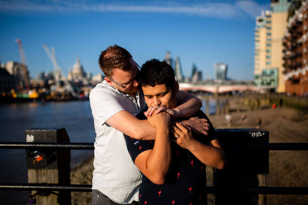 Neill Iggy hug from behind on Gay Engagement shoot on London Southbank image by Engagement Chapter via Gay Wedding Guide 1 4