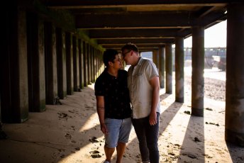 Neill Iggy Look At Each Other Under Bridge On Gay Engagement Shoot On London Southbank Image By Engagement Chapter Via Gay Wedding Guide 1 4 344X230