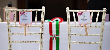 Personalised Chairs For Lesbian Brides At Their Lesbian Wedding With Gay Wedding Celebrant Italy Tonigar Ceremony By Antonino Via Gay Wedding Guide 6 380X174