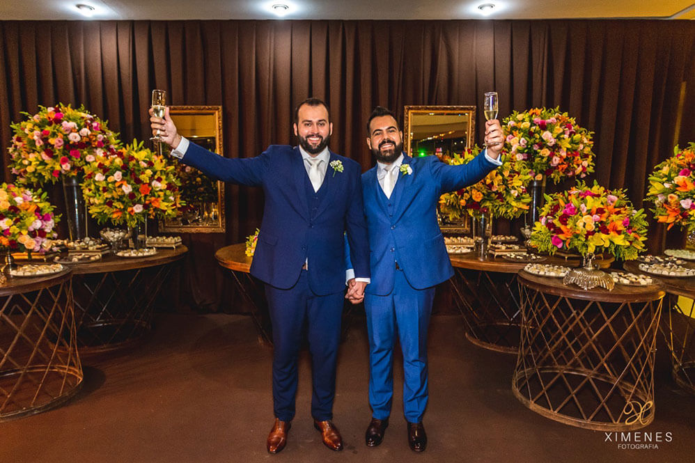 Raising a glass toast at Pedro and Pedro gay wedding Brasil 1 5