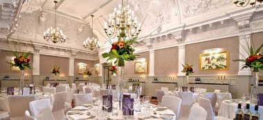 Reception Layout With Orange Flowers At St Ermins Hotel Westminster Wedding Venue Sw1 Gay Wedding Guide 9 380X174