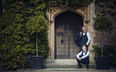 Sam And Kyle Gay Wedding Photos Sit Outside A Door Image Copyright Shooting Pixels Featured On The Gay Wedding Guide 3 5 372X230