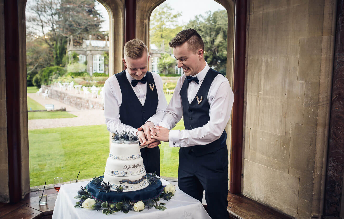 Sam at his gay wedding photos cutting the cake image copyright Shooting Pixels featured on The Gay Wedding Guide 3 5