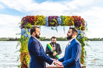 Saying Vows Under Floral Arch At Pedro And Pedro Gay Wedding Brasil 1 5 345X230