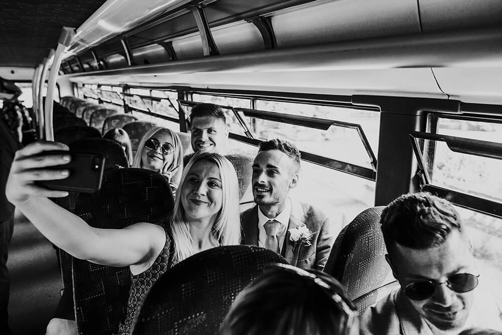 Selfie on bus at Lee and Simon Gay wedding at Bombay Sapphire Distillery Gay Wedding Guide image by This and That Photography 1 5