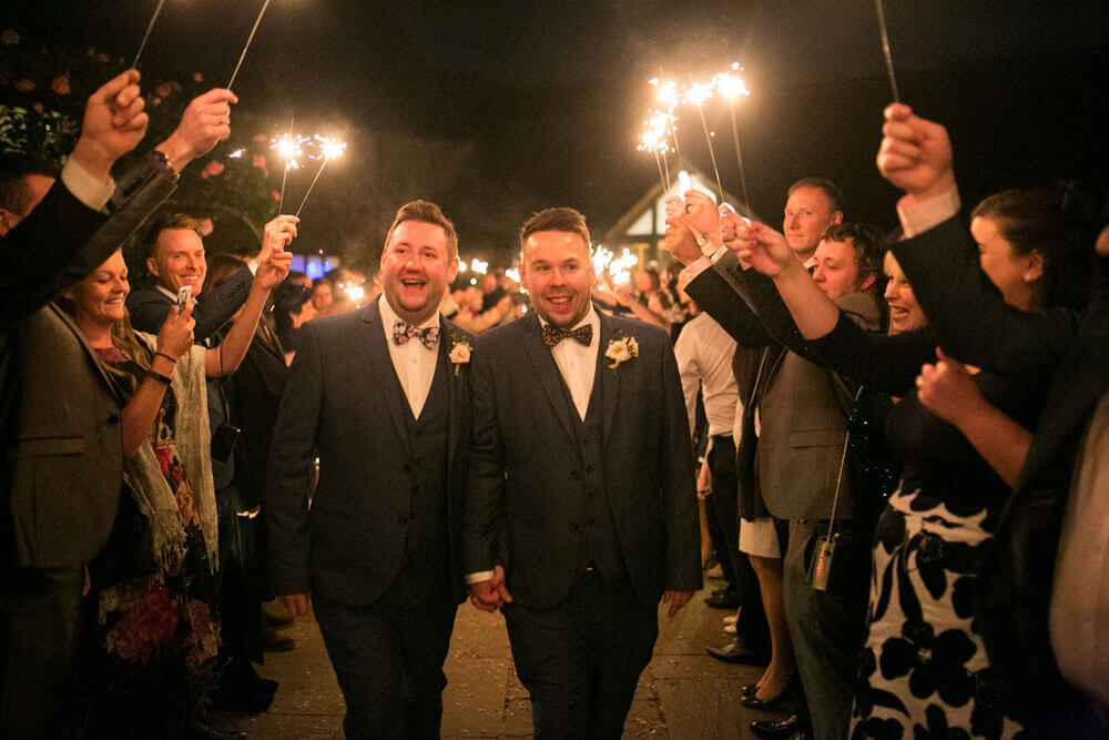 Sparkler tunnel at David and Stephen real gay wedding image by Ryan Welch Photography via the Gay Wedding Guide 1 5