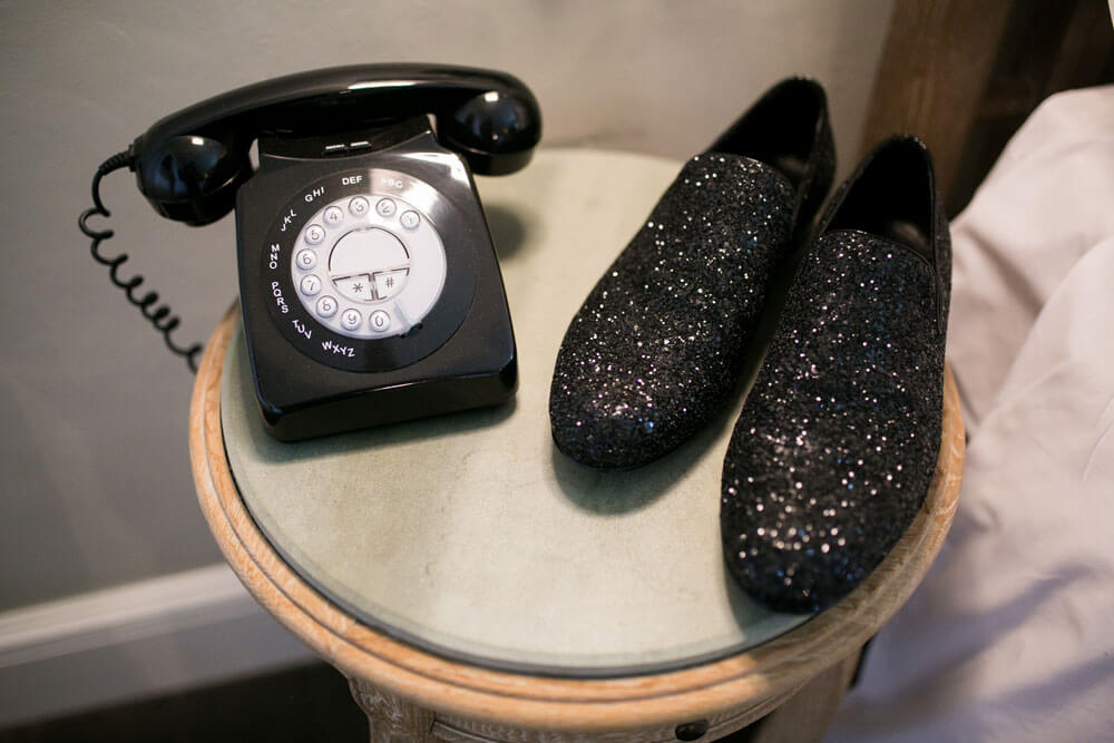 Sparkly jimmy choo shoes by phone at David and Stephen real gay wedding image by Ryan Welch Photography via the Gay Wedding Guide 1 5