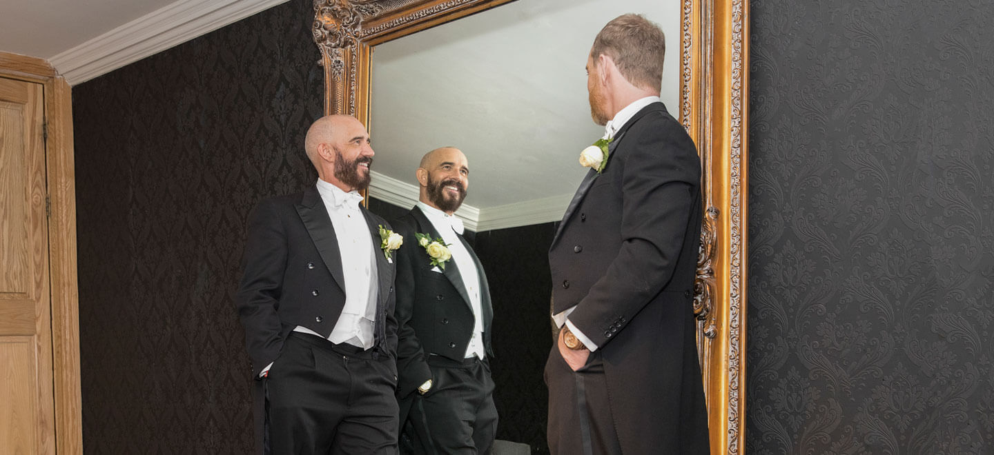 Standing by mirror at Glen Jason gay wedding photographer This World Wedding Photography via Gay Wedding Guide 6