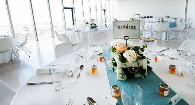 Table decor at Guy and Andrews same sex art gallery wedding at the Turner Contemporary wedding in margate photo by Webb Weddings 3 5
