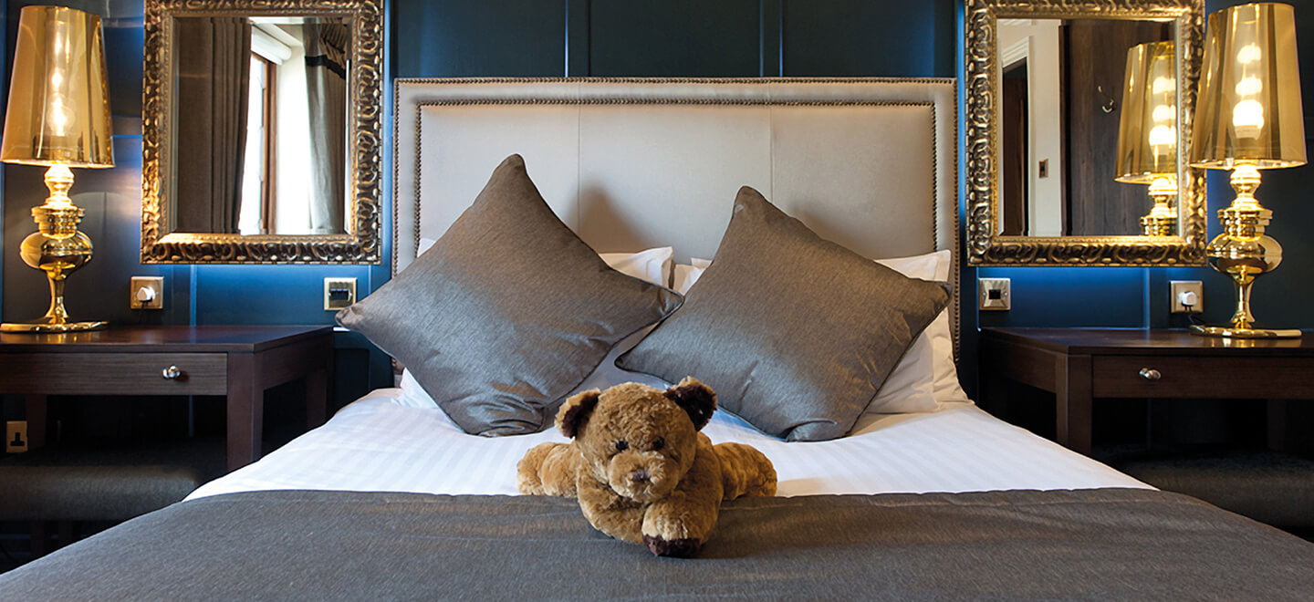 Teddy on bed at The Moat House Wedding Venue Staffordshire gay wedding guide 9