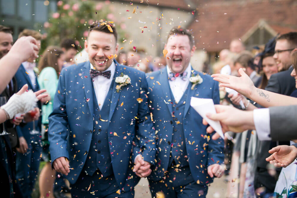 Throwing confetti at David and Stephen real gay wedding image by Ryan Welch Photography via the Gay Wedding Guide 1 5