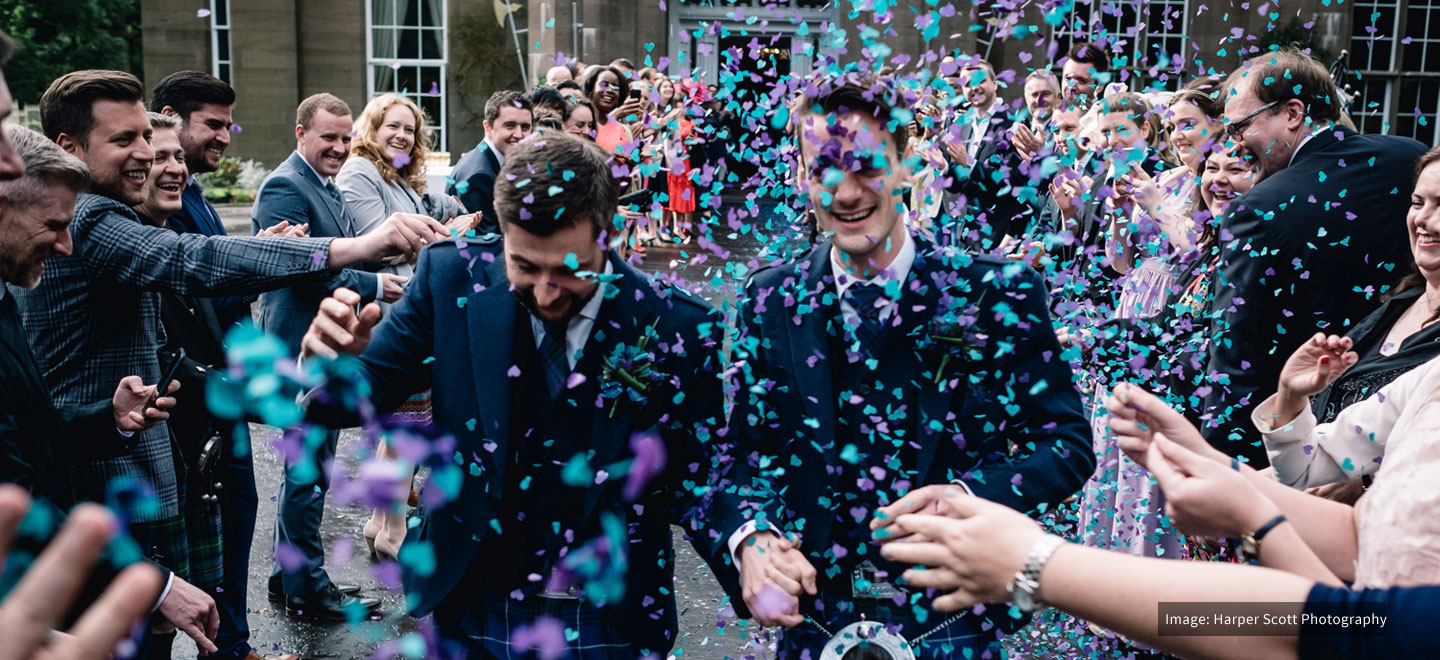 Trevor and Adam confetti shower at their gay wedding at Drumtochty Castle wedding venue Scotland image by Harper Scott Photography 9