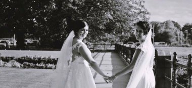 Two Brides Holding Hands At Hilton Chester Wedding Venue Cheshire Gay Wedding Guide 9 380X174