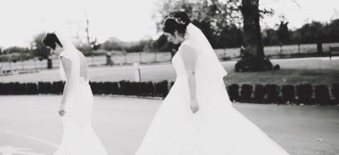 Two Brides Walking At Hilton Chester Wedding Venue Cheshire Gay Wedding Guide 9 380X174