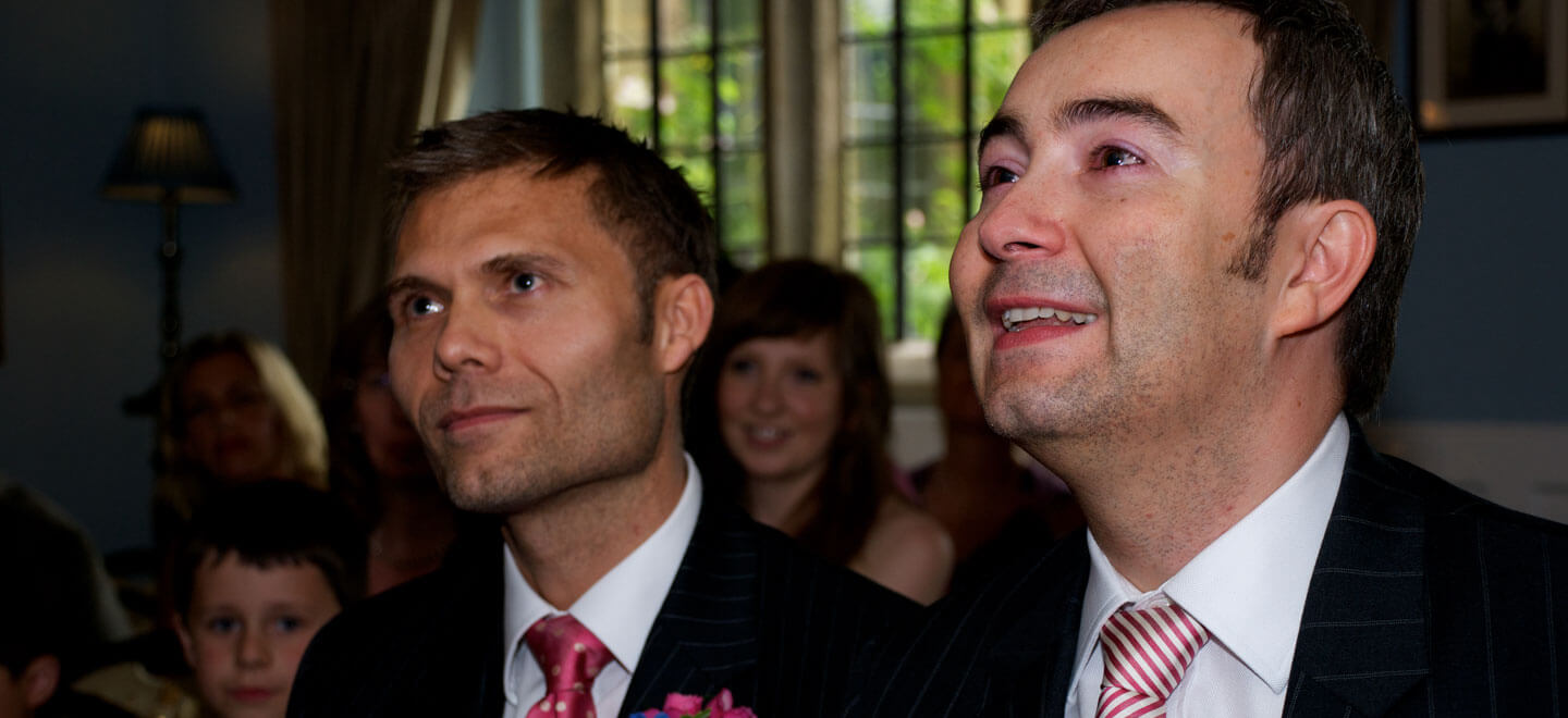 Two Grooms Holding Hands Gay Wedding Rings Image by Tony Hall Gay Wedding Photographer Derby 6