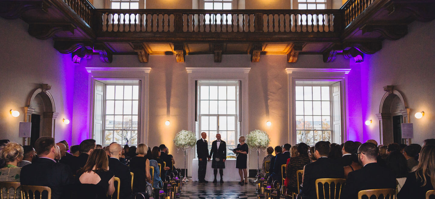 Two gay grooms marry at the National Maritime Museum unique wedding venue Queens House Greenwich wedding venue via the Gay Wedding Guide 9