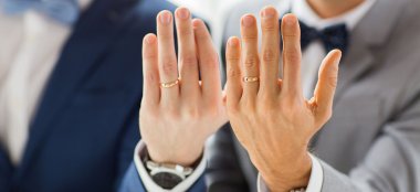 Wedding Rings On Hands Of Gay Couple At Beach Weddings Bournemouth Gay Wedding Guide Image Copyright Anna Morgan Photography 9 380X174