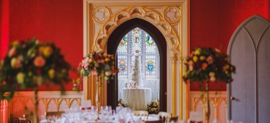 Wedding Cake Through Arched Door At Unique Wedding Venue Strawberry Hill House Via Gay Wedding Guide Image By Owen Billcliffe Photography 9 380X174