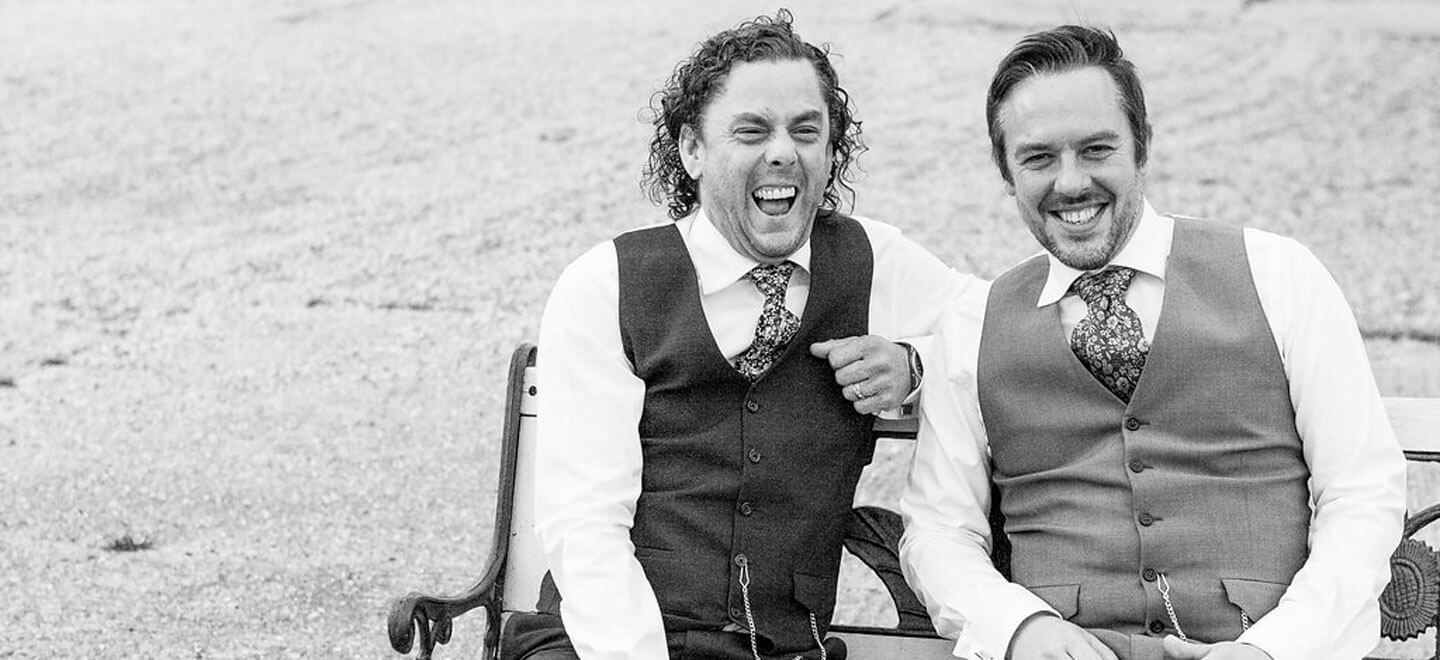 black and white sitting on bench Real Gay Wedding of Shaun and Carl via The Gay Wedding Guide images by Ross Willsher 3 5