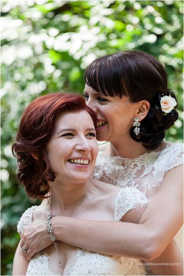 brides cuddle at lesbian destination wedding of Sara and Karen photograph by Paola de Paola Photography 3 5
