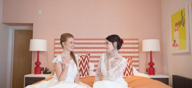 Brides On Bed At Brighton Harbour Hotel Gay Friendly Beach Wedding Venue In Brighton 9 380X174