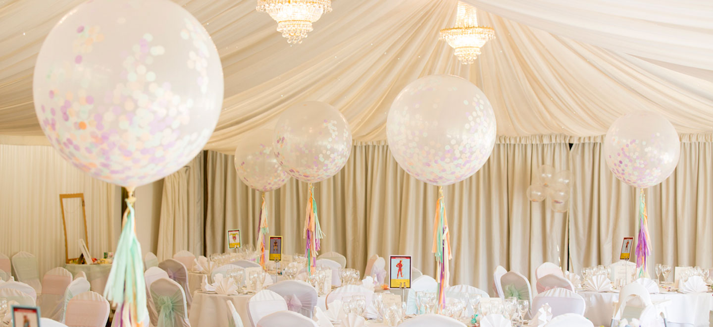 cream wedding theme with big confetti balloons at Fennes Gay Wedding Venue in Essex 9
