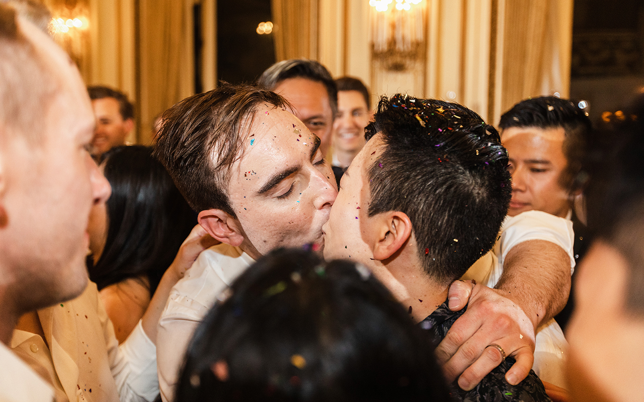 derrick kissing michael while in the group hug at their gay wedding party 5