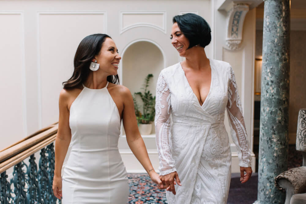 hand in hand 2 Suria and Paige lesbian wedding The Grand Brighton image by In Between Days 1 5