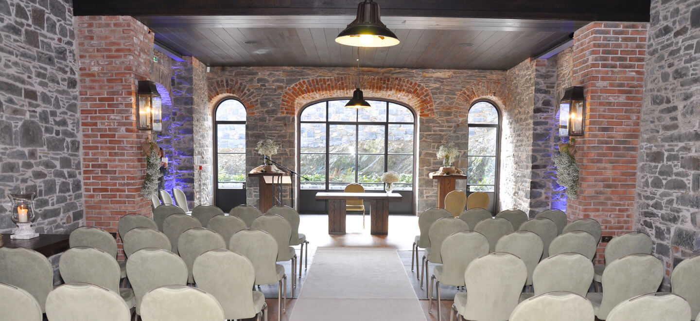 indoor barn wedding ceremony setting at wedding venue ballynahinch the Carriage Rooms a barn wedding co down 9