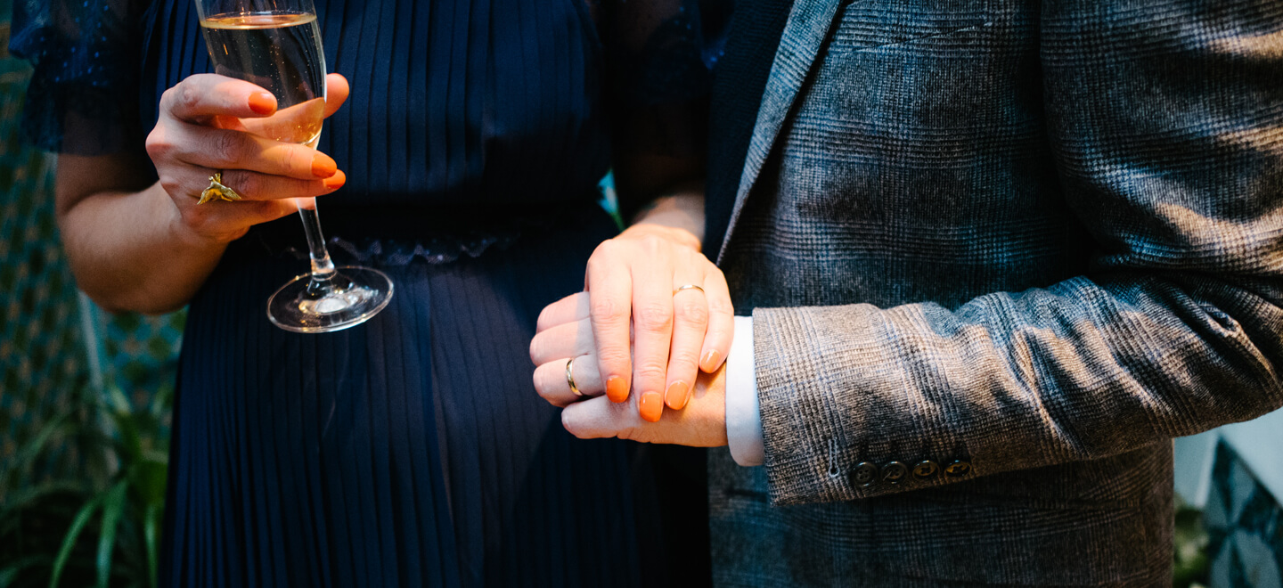 jamie and Jessica touch hands at their lesbian wedding photograph by LEA Attentive via Gay Wedding Guide 6