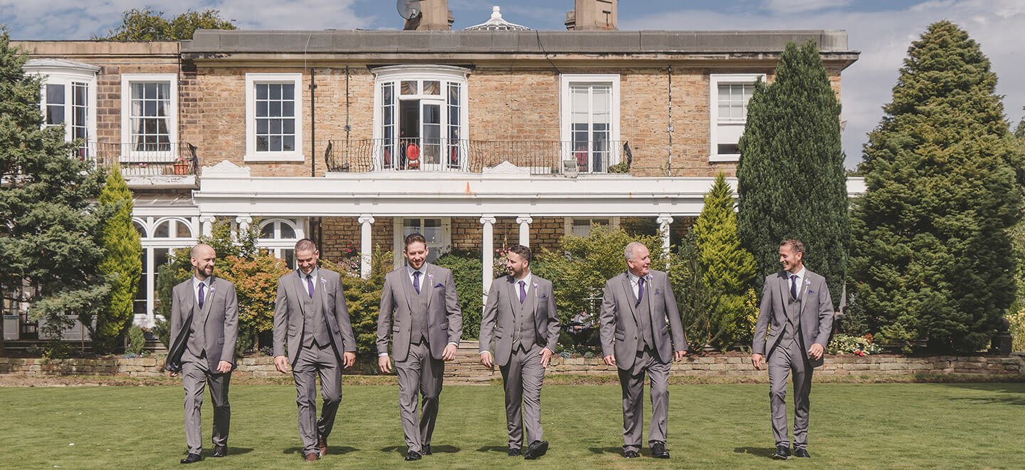 men on lawn at ringwood hall country house wedding venue gay wedding guide 9