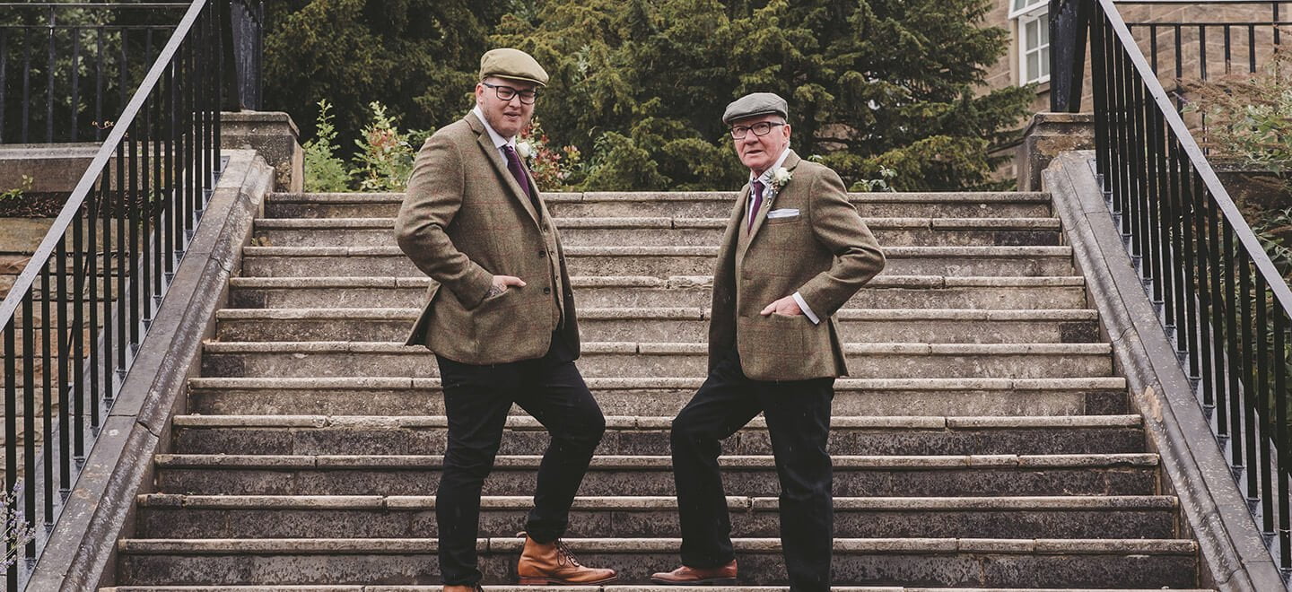 men on steps at ringwood hall country house wedding venue gay wedding guide 9